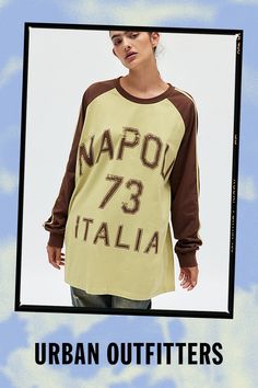 Jersey-inspired long sleeve graphic tee. Designed in an oversized fit & raglan style featuring a Napoli 73 Italia graphic across the front in varsity print for a sporty vibe. Only at Urban Outfitters. Features Napoli 73 oversized long sleeve graphic tee Oversized graphic tee Washed soft for a vintage look & feel Contrasting raglan crew neckline & sleeves with stripe details Napoli 73 Italia varsity-style graphics across the front Oversized, relaxed fit Tunic length Easy pull-over style UO exclus Retro Long Sleeve Tops With Screen Print, Casual Brown Tops For College, Retro Long Sleeve Tops With Letter Print, Winter Streetwear Tops With Raglan Sleeves, Oversized Retro Tops With Letter Print, Brown Crew Neck Top For College, Trendy Oversized Tops From Urban Outfitters, Oversized Varsity T-shirt For Fall, College Long Sleeve Graphic Print Tops