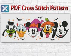 mickey mouse and friends cross stitch pattern on a white brick wall with the words halloween