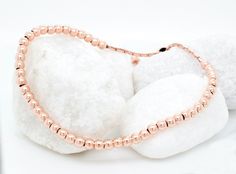 "For a charming addition to her collection, consider this 14k rose gold plated beaded ball bracelet, perfect for stacking and layering. Whether as bridesmaid jewelry or a thoughtful gift idea for her, it exudes dainty elegance, ideal for those who appreciate delicate bead jewelry. 𝐃𝐄𝐓𝐀𝐈𝐋𝐒 💎 1 bracelet, included 💎 Material: Sterling Silver, 14k Rose Gold Plated 💎 2mm: bead size 💎 Adjustable 𝐇𝐎𝐖 𝐓𝐎 𝐎𝐑𝐃𝐄𝐑 1. Select the color of the bracelet 2. Select the thickness 3. Select des Minimalist Rose Gold Beaded Bracelets As Gift, Dainty Rose Gold Stackable Bracelets, Stackable Rose Gold Beaded Bracelets, Rose Gold Beaded Bracelets As Gift, Hypoallergenic Dainty Rose Gold Beaded Bracelets, Rose Gold Stackable Beaded Bracelets, Round Hypoallergenic Rose Gold Bracelets, Hypoallergenic Round Rose Gold Bracelets, Hypoallergenic Rose Gold Beaded Bracelet Gift