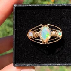 Triple Ethiopian Opal Wire Wrapped Ring Made By (Ig @) Potatosproutcrafts Size 11 3 Ethiopian Opal Cabs Wrapped In 14k Gold Fill Wire Brand New, Only Worn A Handful Of Times Price Is Firm Handmade Opal Toe Ring As Gift, Handmade Opal Ring Jewelry, Handmade Adjustable Opal Ring As Gift, Handmade Bohemian Opal Ring As A Gift, Unique Hand Wrapped Opal Jewelry, Handmade Opal Jewelry In Yellow Gold, Handmade Yellow Gold Opal Jewelry, Food Spread, Wire Wrapped Ring