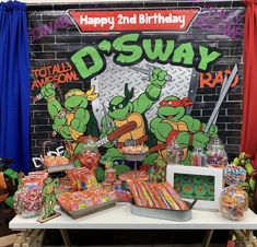 a table topped with lots of candy and decorations