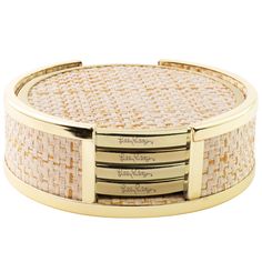 a gold and white basket with three compartments on the bottom, in front of a white background