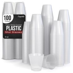 white plastic cups are lined up next to each other and one cup has a black label on it