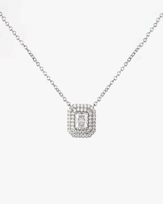 - Princess cut gemstone with Surrounding round cut stones Necklace- Made in Sterling silver set with a high-quality Cubic Zirconia. - Stone size: Princess cut 5.00 x 7.00 mm, Round cut 1.10 mm- Size : 12 x 14 mm ( 0.47 x 0.55 inch )- Chain length : 16 inch Sterling silver925 Sterling Silver is an alloy made of 92.5% pure silver and 7.5% copper. We plate our silver jewelry in rhodium, which gives it extra shine and durability. Rhodium is one of the costliest precious metals due to its rarity.Care White Gold Necklaces With Single Cut Cubic Zirconia, Elegant Silver Solitaire Necklace With Single Cut Diamonds, Platinum Diamond Gemstone Necklace For Wedding, Platinum Diamond Necklace With Gemstone For Wedding, Wedding Platinum Diamond Necklace With Gemstone, Silver Diamond-cut Necklace, Formal Silver Diamond Chain Necklace, Dazzling Diamond White Solitaire Crystal Necklace, Silver Diamond Solitaire Necklace, Dazzling Style