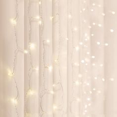 the curtain is covered with white lights