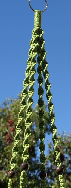 a wind chime hanging in front of a blue sky