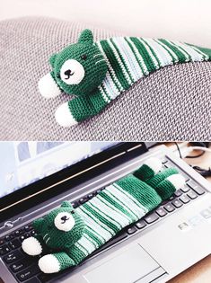 there is a stuffed bear on top of a laptop keyboard and it's cover has been crocheted