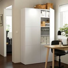 an office with a desk, chair and bookshelf