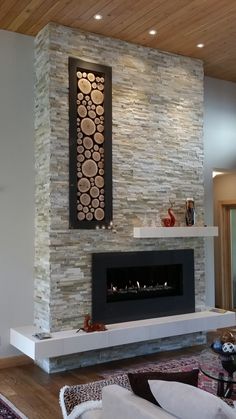 a living room with a large stone fireplace