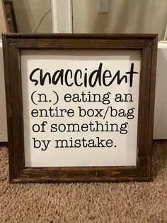 a framed sign that says, snackin't n eating an entire box / bag of something by mistake