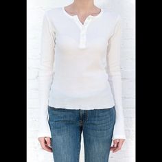 Soft And Stretchy Cotton Henley Thermal Top With 5 Button Detailing. Fabrics: 100% Cotton Measurement: 23" (58cm) Length, 20" (51cm) Bust Made In: Italy Fitted Henley Neckline Top For Everyday, White Cotton Henley With Buttons, Spring Button-up Henley With Buttons, Classic Fitted Tops With Henley Neckline, Spring Button-up Henley, Classic Henley With Button Closure, Spring Fitted Henley With Henley Neckline, Spring Button-up Henley With Button Closure, Fitted Tops With Button Cuffs For Everyday