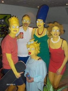 a group of people dressed up as simpsons posing for a photo with one person holding a skateboard