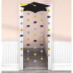 a door decorated with stars and a graduation cap