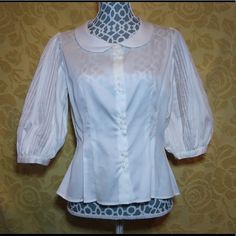 Designed By Maha Barsom 100% Cotton Excellent Condition Still Has Tags Original Price $595 This Button Up Has Pleated Puffy Half Sleeves. With A Peterpan Collar. Also It It Buttoned Down In 4 Section Of 3 Mini White Buttons. Elegant Fitted Blouse With Button Closure, Formal Fitted Blouse With Button Closure, Elegant Fitted Blouse With Covered Buttons, Fitted Classic Blouse With Covered Buttons, Elegant Fitted Top With Back Button Closure, Classic Formal Blouse With Pearl Buttons, Classic Blouse With Puff Sleeves And Button Cuffs, Classic Fitted Padded Blouse, Formal Fitted Blouse With Buttons