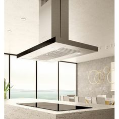 a modern kitchen with an island in the middle and large windows on both sides, overlooking the ocean