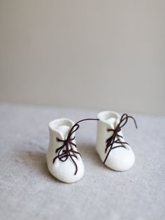 Nice idea for baby shower gift - beautiful baby booties in pure natural ivory white. Made without any seams from eco friendly organic 100% Merino wool using just water and olive oil soap. Such natural wool booties is a perfect way to share the news with your loved ones. They are perfect for baby shower gift, a great gift for a just born baby, can be used for taking special photos, perfect for Christening. Felted baby shoes are very suitable for babies as they are made of natural soft wool that l White Lace-up Booties With Soft Sole, Gift Rubber Sole Round Toe Booties, Gift Booties With Rubber Sole And Round Toe, Comfortable White Winter Booties, White Booties As Winter Gift, Comfortable White Closed Toe Booties, White Winter Booties As A Gift, White Winter Booties As Gift, Comfortable Round Toe Booties As Gift