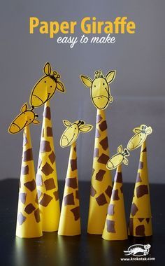 paper giraffes are lined up in the shape of cones with text overlay that reads, paper giraffe easy to make