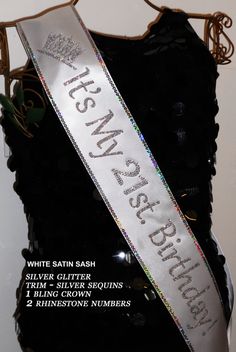 a white sash with silver sequins and the words sisters are forever on it