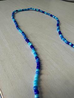 handmade beaded necklace in "the blues" size 16-17 inches the necklace is elastic and is not a choker, but does fit somewhat snug on most people thank you for checking out my shop! :) Blue Beaded Necklace, Handmade Beaded Necklaces, Blue Beads, How To Make Beads, Chain Styles, Hair Wrap, Necklace Etsy, Beaded Necklace, Handmade Items