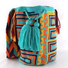 Brand-New Hand Knitted Wayuu Bag Imported From Columbia. 2 Tread. Size Large. Color: Turquoise, Orange, Red, And Royal Blue. One Of A Kind. 50% Off. Blue Woven Bucket Shoulder Bag, Multicolor Bags With Woven Motifs For Festivals, Blue Crocheted Woven Bucket Bag, Blue Bohemian Woven Crochet Bag, Blue Crochet Bucket Bag With Braided Handles, Multicolor Crochet Bucket Bag, Blue Woven Crochet Bucket Bag, Crochet Wayuu Bag Pattern Free, Hand Knit Bag