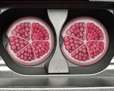 two pomegranates are shown in the shape of hearts