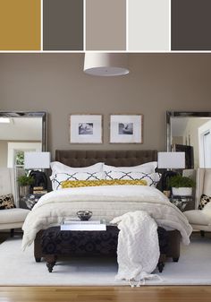 a large bed sitting in a bedroom on top of a hard wood floor next to two lamps