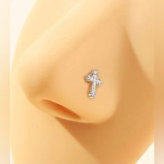 an earring with a cross on it