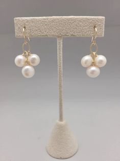 Three freshwater pearls dangle from gold filled chain. Simple, sophisticated and easily dressed up or down all year long. Lightweight and perfect for bridesmaids or graduation gifts.  All pieces will be packaged together in a cotton filled jewelry box unless otherwise specified. Please let us know if your order is a gi 14k Gold Filled Pearl White Dangle Pearl Earrings, 14k Gold Filled Pearl Chain Jewelry For Anniversary, Handmade 14k Gold Filled Pearl White Jewelry, Pearl White 14k Gold-filled Drop Earrings, Pearl White Pearl Drop 14k Gold Filled Earrings, 14k Gold-filled Pearl White Dangle Pearl Earrings, Elegant 14k Gold Filled Pearl Drop Jewelry, Classic 14k Gold Filled Pearl Drop Jewelry, Dangle Pearl Earrings For Bridesmaid Gift