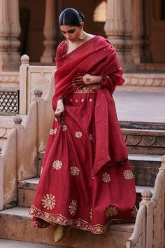 Vermillion red flared raw silk lehenga with edelweiss bloom motif zardozi embroidery. Paired with a half sleeves pure silk sweetheart neck blouse with floral motif buta zardozi embroidery and organza dupatta adorned with spluttered zardozi accents. - Aza Fashions Red Slub Silk Sets For Festivals, Red Slub Silk Traditional Wear For Wedding, Wedding Choli In Fitted Slub Silk, Wedding Slub Silk Lehenga For Navratri, Festive Slub Silk Wedding Sets, Festive Wedding Slub Silk Sets, Slub Silk Lehenga For Diwali, Festive Slub Silk Lehenga For Diwali, Festive Fitted Lehenga In Slub Silk