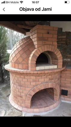 an outdoor brick pizza oven built into the side of a building