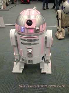 a toy r2d2 is sitting on the floor