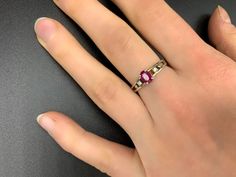 Handmade, antique ruby ring in 925 silver. It was manufactured in Germany in the 1960s and professionally reworked by a goldsmith in the 2000s.The ring has a 925 stamp inside and is studded with a ruby (approx. 6 mm x 4 mm x 1.5 mm). It is size 16 (56 1/2 or 7 3/4 in USA/ PQ in UK) More precisely the inside ring measures 19 mm x 19 mm x 2 mm at the narrowest point. The outer dimensions of the ring are 21 mm x 24 mm x 6 mm. The ring weighs 12,410 carats.On request with certificate of authenticity Ruby Diamond Promise Ring Hallmarked, Ruby Diamond Promise Ring, Emerald Cut Ruby Ring With Hallmark, Hallmarked Emerald Cut Ruby Ring, Pink Ruby Rings With 17 Jewels, Red Pink Sapphire Rings, Pink Ruby Ring Hallmarked, Hallmarked Pink Ruby Rings, Vintage Sterling Silver Ruby Ring Gift