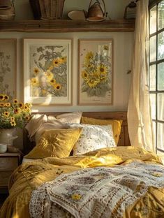 a bedroom with sunflowers on the wall and pictures above the bedspread