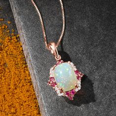 Ross-Simons - Ethiopian Opal, .20ct t. w. Ruby Pendant Necklace, Diamond Accents. 18". Like an enchanting art piece, this pendant necklace showcases an iridescent 7x9mm Ethiopian opal rectangle cabochon in a fanciful frame of .20 ct. t. w. rubies with diamond accents. Crafted in glowing 14kt rose gold. Box chain includes 2" extender. Lobster clasp, ruby and Ethiopian opal pendant necklace. Ruby birthstones are the perfect gift for July birthdays. Exquisite Birthstone Pendant Necklace, Fine Jewelry Large Pendant For Anniversary, Fine Jewelry White Square Pendant, Gift Necklace With Diamond Accents And Rectangular Pendant, White Square Pendant Jewelry For Anniversary, White Square Pendant Fine Jewelry, Exquisite Birthstone Pendant Jewelry, Diamond White Gemstone Pendant Necklace, Diamond White Rectangular Pendant Necklace As Gift