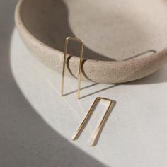 A minimal earring that's perfect for everyday. Wear them in your second ear holes or let them be the main adornment for your ear lobes! Either way, these earrings will become one of your daily staples (pun, intended!). DETAILSThe earrings measure approx. 1.25" long by .25" wideChoose from 14k gold fill or sterling silverHypoallergenic, waterproof, and nickel free Staple Earrings, Let Them Be, Jewelry Staples, Minimal Earrings, Gold Gifts, Forever Jewelry, Earring Sale, Ring Size Guide, Geometric Earrings