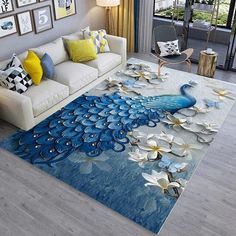 a living room area rug with a blue and white peacock on it