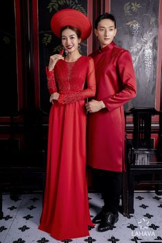 a man and woman dressed in red standing next to each other