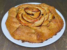 an apple pie is on a white plate