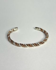 Handcrafted sterling silver and copper wire braided cuff bracelet. Only 1 available. Thickness: 3.7-4.3mm approx Width: 2.04" inches  Cuff length: 13cm  Cuff opening: 1.02" inches Fits wrists around 16.5cm in circumference. Item weight: 9.61g Adjustable Copper Cuff Bracelet, Bohemian Silver Copper Bangle, Handmade Copper Cuff Bangle, Handmade Copper Braided Bangle Bracelet, Elegant Silver-colored Copper Cuff Bracelet, Braid Cuffs, Handmade Bangles, Bracelet Handmade, Copper Wire