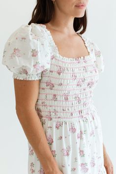 The Julia Dress is just dreamy and sweet! Made of 100% cotton, this dress features a smocked bodice that offers a flattering fit and an easy, flowy silhouette. With its sweet floral print, ruffle details, and full lining, its not only adorable but comfortable making it a go-to dress for a breezy, chic look. Hamptons Collection FIT Easy True To Size Fit Smocked Bodice Lined Bridget is 5'9 Wearing Size Small SMALL MEDIUM LARGE 54" Long 55" Long 56" Long 12" Wide 13" Wide 14" Wide For more sizing i Church Fits, Dress Book, Church Dress, Julia Dress, Church Outfits, Large Dress, Chic Look, Sweet Floral, Maternity Shops