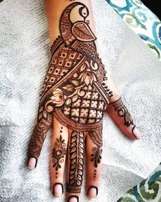 henna tattoo on the palm of someone's hand