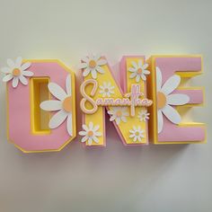 the letter o is made up of flowers and letters that spell out the word love