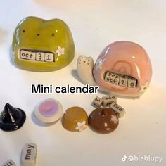 a close up of many different items on a table with the words mini calendar written below them