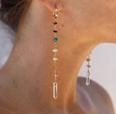 "These huggie style duster earrings feature strands of rainbow gemstones- one stone for each of the 7 chakras. From bottom to top, strand includes pink tourmaline, carnelian, citrine, peridot, turquoise, lapis lazuli and amethyst. The bottom of the earrings are finished with one sparkling clear crystal quartz point. Huggie hoops are 0.5 inch and earrings hang about 4.5 inches in total. ~Why to wear chakra gemstone jewelry~ Chakra jewelry that is made with the earth's natural gemstones is known t Chakra Stones Jewelry, Chakra Earrings, Pride Earrings, Duster Earrings, Gemstone Earrings Dangle, Seven Chakra, Chakra Jewelry, Handmade Wire Jewelry, Bijoux Diy