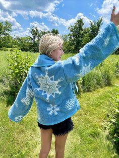 Introducing my latest creation! Reworked a cozy fleece snowflake blanket into the most adorable fleece cardigan. Measurements: Chest: 44" Overall length: 30" Sleeve length: 22" This statement jacket was made with all of my heart, for any human, anywhere, that may be attracted to its vibe! My intention is that the piece will amplify the divine nature of your inner being. ✨🌙 Cozy Blue Sweater Coat For Winter, Blue Long Sleeve Fleece Jacket For Winter, Cozy Blue Outerwear For Winter, Cozy Blue Winter Outerwear, Blue Winter Cardigan For Cold Weather, Cozy Blue Outerwear For Loungewear, Cozy Winter Fleece Jacket For Loungewear, Blue Winter Cardigan For Loungewear, Cozy Blue Outerwear For Cold Weather