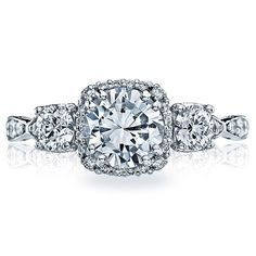 tacori engagement ring with three stones on the band