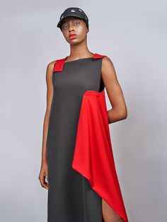 The Nigerian sister design duo Sylvia and Olivia Enekwe-Okoji transform the classic LBD into something much cooler in this Ace Wrap Dress. From the dramatic draped panels and asymmetric hem to the bright red accents—the result is just edgy enough to catch eyes but not turn heads. Pair with modern mules and a sleek, slicked-back hairstyle when visiting galleries at the weekend.- Sleeveless, square neckline, paneled construction, asymmetric flared hem, mid-calf length, slip-on- Polyester- Artisana Red Carpet Ready, Slicked Back Hair, Statement Shoe, Dress Crafts, Mini Shift Dress, Small Tops, Asymmetric Hem, Skirted Swimwear, High Collar