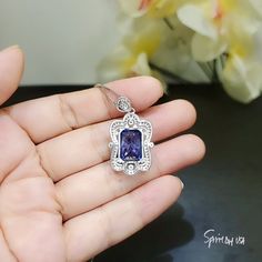 "Large Tanzanite Jewelry Rectangular Royal Flower Style Unique Artisan design Full Sterling Silver Made Luxury Gemstone Jewelry ◆◆Pendant Main stone:10*14mm Created Tanzanite 10CT Pendant Height ( include bail) : 30.9mm Pendant Holder (bezel & Bail) : White Gold Coated fine 925 Sterling Silver Accent Stone: Sim Diamond ◆◆ Necklace chain : Platinum gold coated 925 sterling silver Chain with length option from 16\" ~ 20\". The model wearing 18\". 16 inch ≈ 40cm 18 inch ≈ 45cm （Most popular siz Rectangular Gemstone Necklace For Formal Occasions, Formal Rectangular Gemstone Necklace, Elegant Formal Necklace With Rectangular Stone Pendant, Elegant Sapphire Necklace With Emerald Cut, Elegant Rectangular Gemstone Accent Necklaces, Elegant Necklace With Rectangular Stone For Formal Events, Elegant Necklace With Rectangular Stone For Formal Occasions, Elegant Formal Necklace With Rectangular Stone, Elegant Rectangular Necklaces With Gemstone Accents