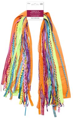 a pair of multicolored scarves with tassels on each one side