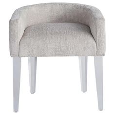 an upholstered chair with white legs